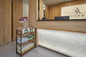 a store with a counter with bottles of alcohol at Yung An Business Hotel in Dounan