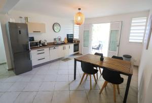 A kitchen or kitchenette at Belle vue de Grande Anse