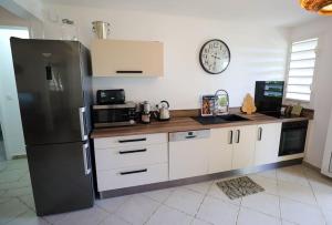 A kitchen or kitchenette at Belle vue de Grande Anse