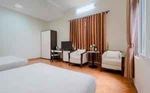 Postel nebo postele na pokoji v ubytování BIDV Central Da Lat Hotel