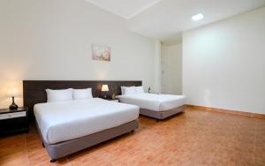 Postel nebo postele na pokoji v ubytování BIDV Central Da Lat Hotel