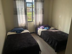 A bed or beds in a room at Casa campestre Boyacá, cerca a lugares turísticos