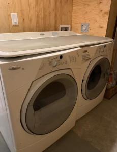 a white washing machine with a counter on top of it at New Townhouse in Red Deer in Red Deer