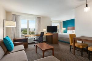 a hotel room with a bed and a desk at Residence Inn By Marriott Las Vegas Stadium Area in Las Vegas