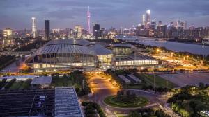 a view of a building in a city at night at Guangzhou Yashe Hotel - Keyun Road Metro Station Pazhou Convention and Exhibition Store in Guangzhou