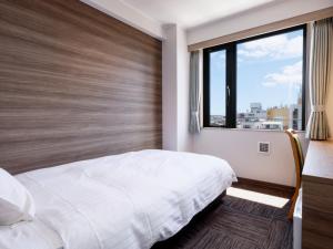 Postel nebo postele na pokoji v ubytování Hotel Kii Tanabe