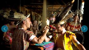 a group of people dressed in indian costumes and hats at Imperial Suites Apartments in Kuching