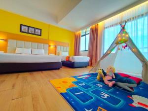Postel nebo postele na pokoji v ubytování Hotel Sentral Seaview @ ​Beachfront