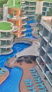an aerial view of a resort with a swimming pool at Twin Sands Resort Penthouse in Patong Beach