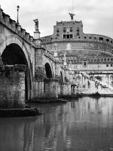 a black and white photo of a bridge over a river at pardis dormitory in Rome
