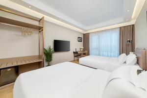 Posteľ alebo postele v izbe v ubytovaní Doria Home International Apartment -Guangzhou Huijin IFC Keyun Road Metro Branch-Canton Fair Free Shuttle