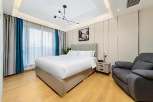 Posteľ alebo postele v izbe v ubytovaní Doria Home International Apartment -Guangzhou Huijin IFC Keyun Road Metro Branch-Canton Fair Free Shuttle