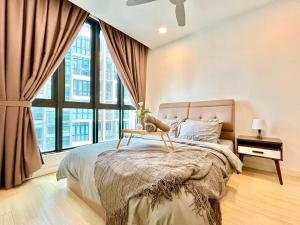 a bedroom with a bed and a large window at 1-8 pax Comfort Place 3room Ara Damansara in Petaling Jaya