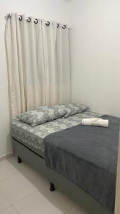 Uma cama ou camas num quarto em Casa Prime - Aluguel por Temporada