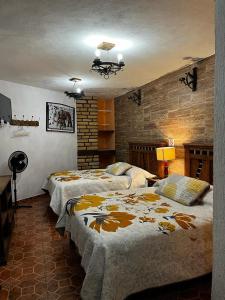 Postel nebo postele na pokoji v ubytování Hotel Huasca Terrazza