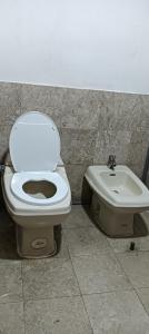 a bathroom with a toilet and a sink at THE ROSEMARY SUITE At TIMES SQUARE in Kuala Lumpur