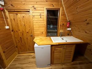 a small bathroom with a sink and a counter at Domek na górze z pięknym widokiem in Bukowiec