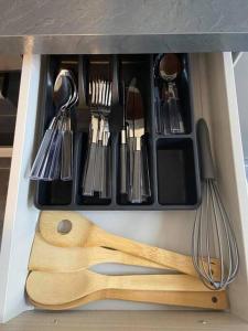 a drawer filled with lots of utensils at Le Navy Blue in Vesoul