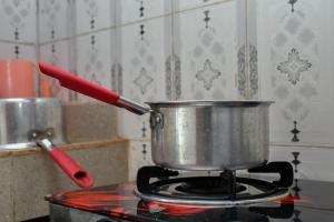 a pot sitting on top of a stove at Ramsi apartment in Nairobi