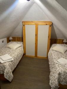 a room with two beds in a tent at Chiar di Luna Apartment in Roccaraso