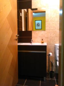 a bathroom with a sink and a mirror at Casa das Argolas in Macedo de Cavaleiros