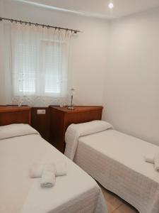 Posteľ alebo postele v izbe v ubytovaní Apartamento Sebastián Solo Familias