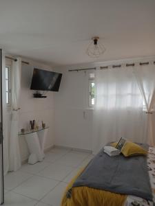 Postel nebo postele na pokoji v ubytování L'INSTANT PRESENT