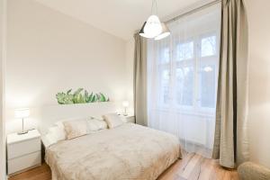 Postel nebo postele na pokoji v ubytování Kubelíkova 32 Residence