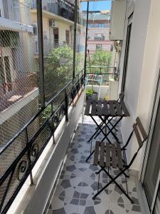 A balcony or terrace at White Tower Minimal Apartment