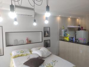 a room with a bed with two pillows on it at Apto 115 N B a 6 km do aeroporto in Núcleo Bandeirante