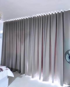 Giường trong phòng chung tại Condo Home in Puerto Princesa near PPS Airport