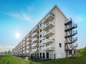 ein Mehrfamilienhaus mit Balkonen an der Seite in der Unterkunft Dünenresidenz Prora - Ferienwohnung mit 2 Schlafzimmern und Balkon B3-2-3 in Binz