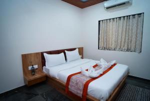 a bedroom with two beds and a window at Altitude Villa A Serene Retreat Panchgani in Panchgani +58 photos