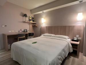 Katil atau katil-katil dalam bilik di 台北馥華商旅 松江館