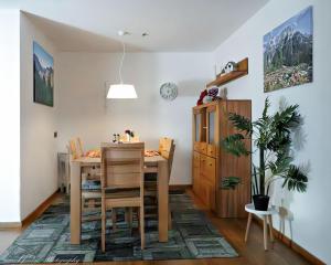 a dining room with a table and chairs at Fewo Am Mühlbach 5 AMB5 in Mittenwald
