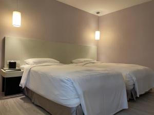 Katil atau katil-katil dalam bilik di 台北馥華商旅 松江館