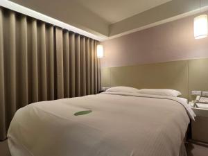 Katil atau katil-katil dalam bilik di 台北馥華商旅 松江館