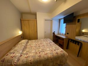 Postel nebo postele na pokoji v ubytování Hotel Sciatori 3 Stelle Superior