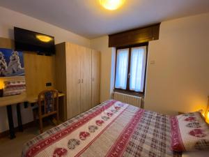Postel nebo postele na pokoji v ubytování Hotel Sciatori 3 Stelle Superior