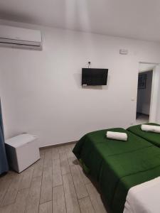 Postel nebo postele na pokoji v ubytování Hotel Faraglione