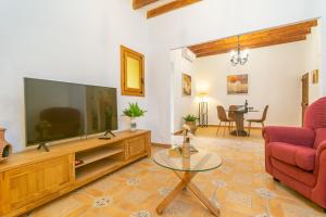 a living room with a large flat screen tv at Sabatera in Inca