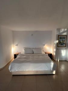 Postel nebo postele na pokoji v ubytování Above the Sea + 54 fotografií