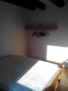 a bedroom with a bed in a room with a window at Au calme à 5min d'Annecy et du lac in Seynod