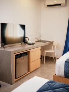 TV a/nebo společenská místnost v ubytování Casa Veles Hotel