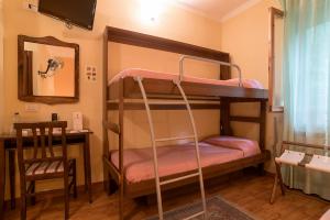 Postel nebo postele na pokoji v ubytování Hotel Relais Valle Orientina