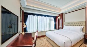 Letto o letti in una camera di Guangming CIMC Executive Hotel Shenzhen