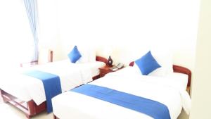 Postel nebo postele na pokoji v ubytování Navy Hotel Cam Ranh