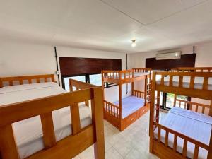 Postel nebo postele na pokoji v ubytování Rodin Bali Hostel