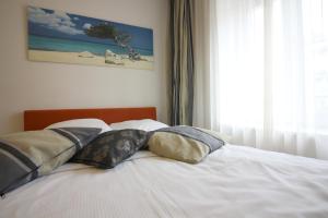 Postel nebo postele na pokoji v ubytování Swiss Star Oerlikon Lodge - Self Check-In