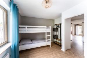 Ένα ή περισσότερα κρεβάτια σε δωμάτιο στο WohlfühlDomizil am Solemar